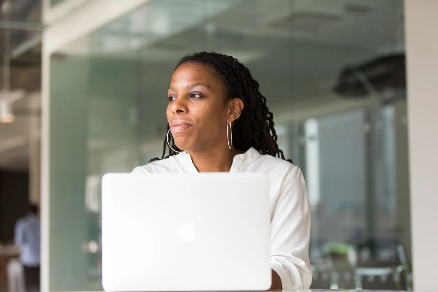 Working professional using a laptop in a contemporary office